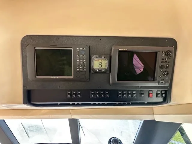 Slide: The Image of Dashboard of 2000 Carver 450 Voyager Pilothouse with navigation systems. - 23