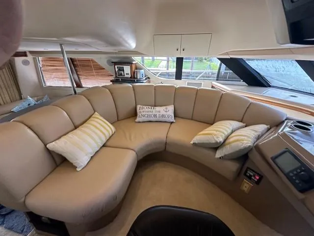 Slide: The Image of Interior of 2000 Carver 450 Voyager Pilothouse yacht with beige sofa and cushions. - 24