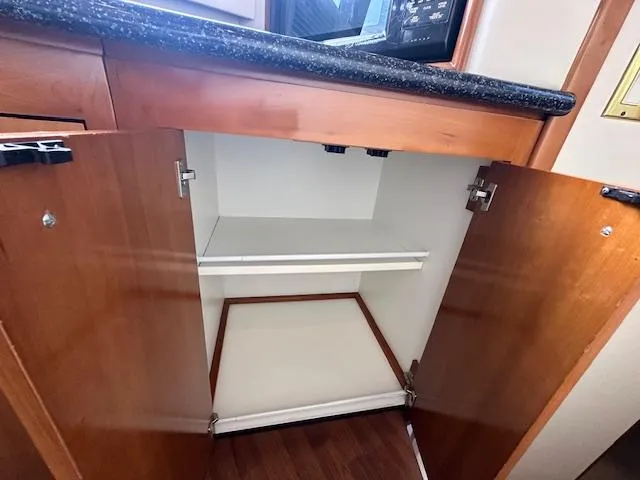 Slide: The Image of Open cabinet in Carver 450 Voyager Pilothouse 2000. - 28