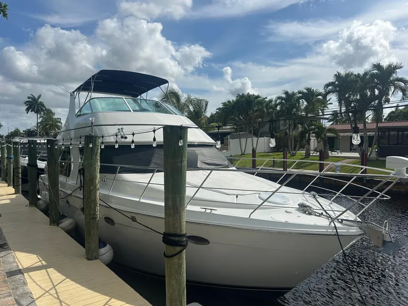 Slide: The Image of 2000 Carver 450 Voyager Pilothouse docked on a sunny day. - 3