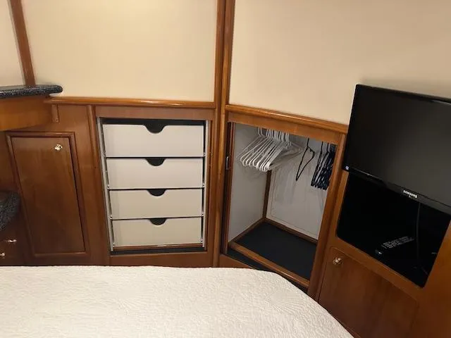 Slide: The Image of Interior of 2000 Carver 450 Voyager Pilothouse with cabinets and TV. - 38