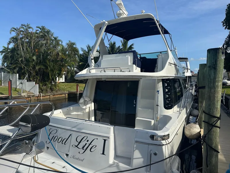 Slide: The Image of 2000 Carver 450 Voyager Pilothouse yacht docked. - 4