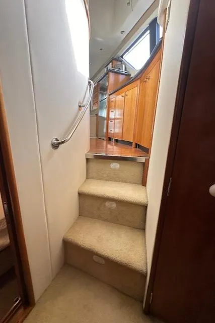 Slide: The Image of Interior of Carver 450 Voyager Pilothouse, stairs leading to kitchen, year 2000. - 42