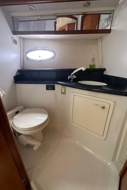 Slide: The Image of Bathroom in 2000 Carver 450 Voyager Pilothouse with sink and toilet. - 48