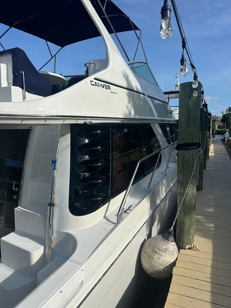 Slide: The Image of Carver 450 Voyager Pilothouse 2000 docked at marina. - 5