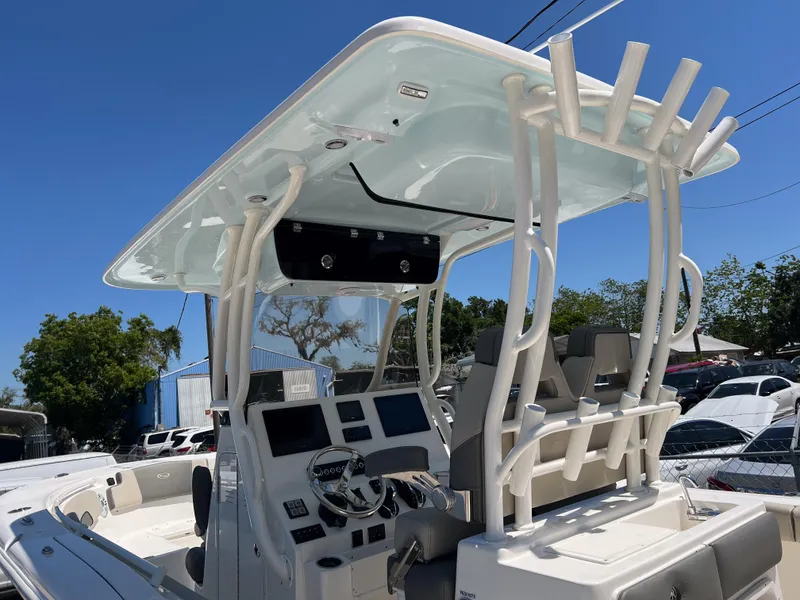Slide: The Image of 2025 Key West 260 Center Console boat with advanced navigation system and rod holders. - 10