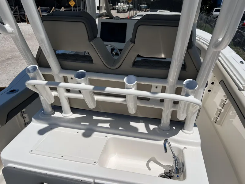 Slide: The Image of 2025 Key West 260 Center Console boat interior with rod holders and seating. - 14