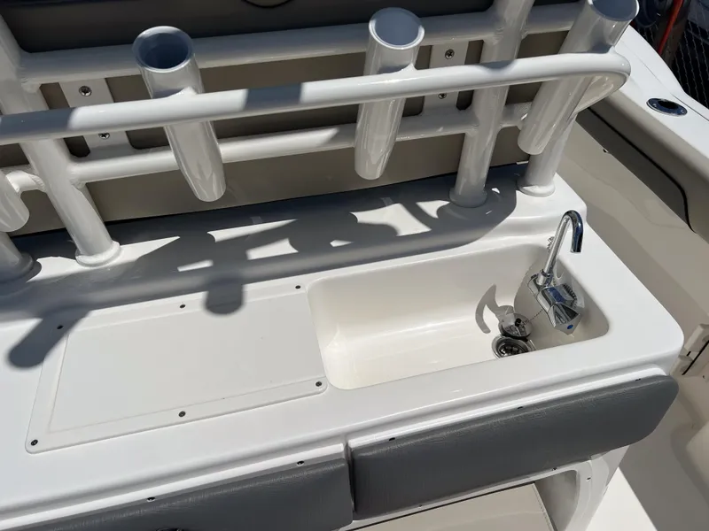 Slide: The Image of 2025 Key West 260 Center Console boat with sink and rod holders. - 16