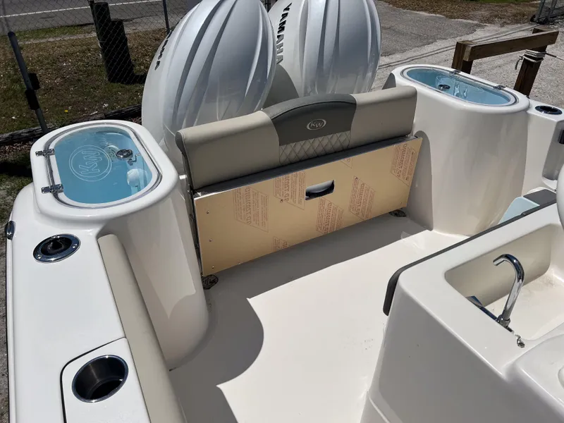 Slide: The Image of 2025 Key West 260 Center Console boat interior with seating and storage compartments. - 22