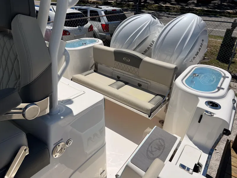 Slide: The Image of 2025 Key West 260 Center Console boat interior with seating and dual Yamaha engines. - 23