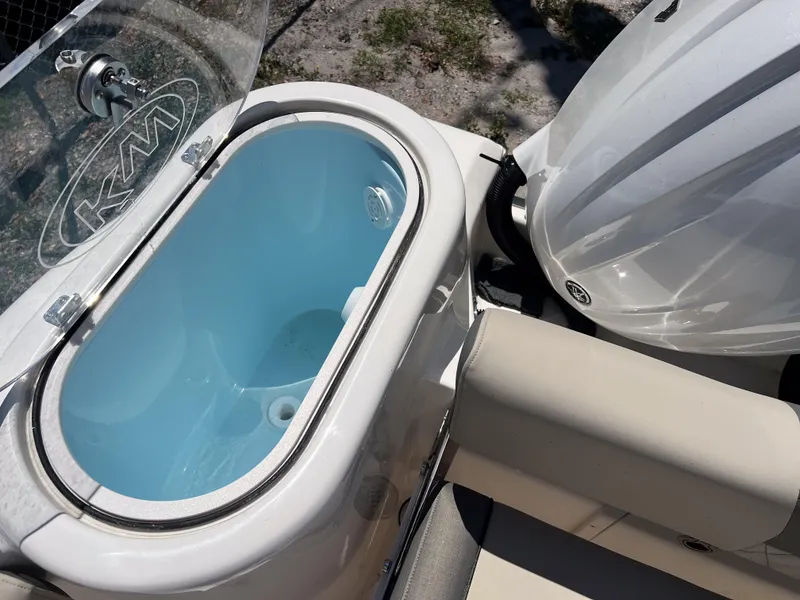 Slide: The Image of 2025 Key West 260 Center Console boat with livewell and engine detail. - 26