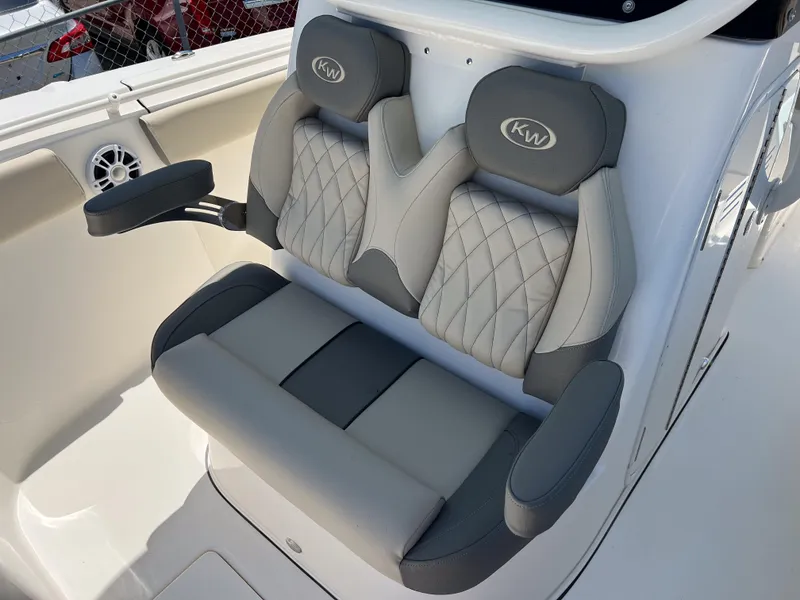 Slide: The Image of 2025 Key West 260 Center Console boat seats with quilted design and armrests. - 30