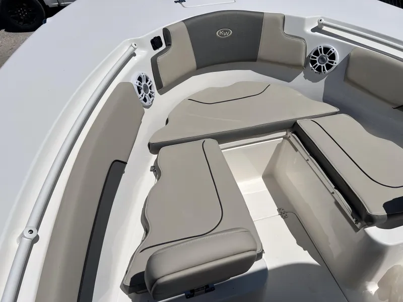 Slide: The Image of 2025 Key West 260 Center Console boat interior with cushioned seating and speakers. - 32