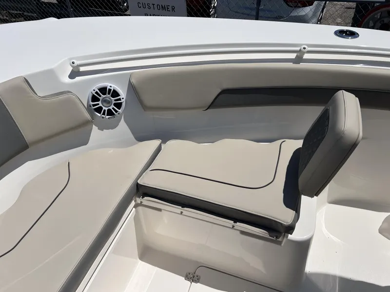 Slide: The Image of 2025 Key West 260 Center Console boat interior with cushioned seating and speaker. - 33
