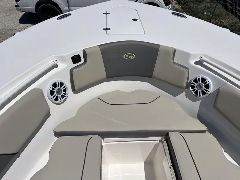 Slide: The Image of 2025 Key West 260 Center Console boat interior with cushioned seating and speakers. - 36