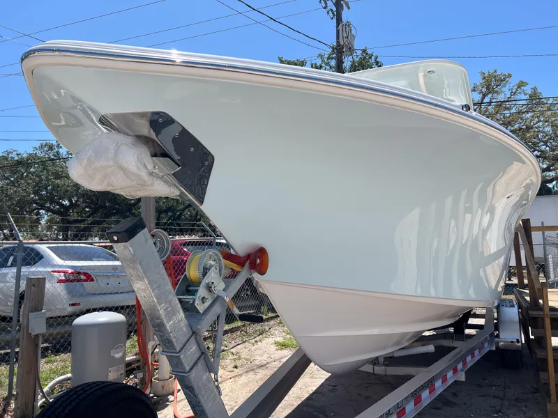 Slide: The Image of 2025 Key West 260 Center Console boat on trailer, parked outdoors. - 8