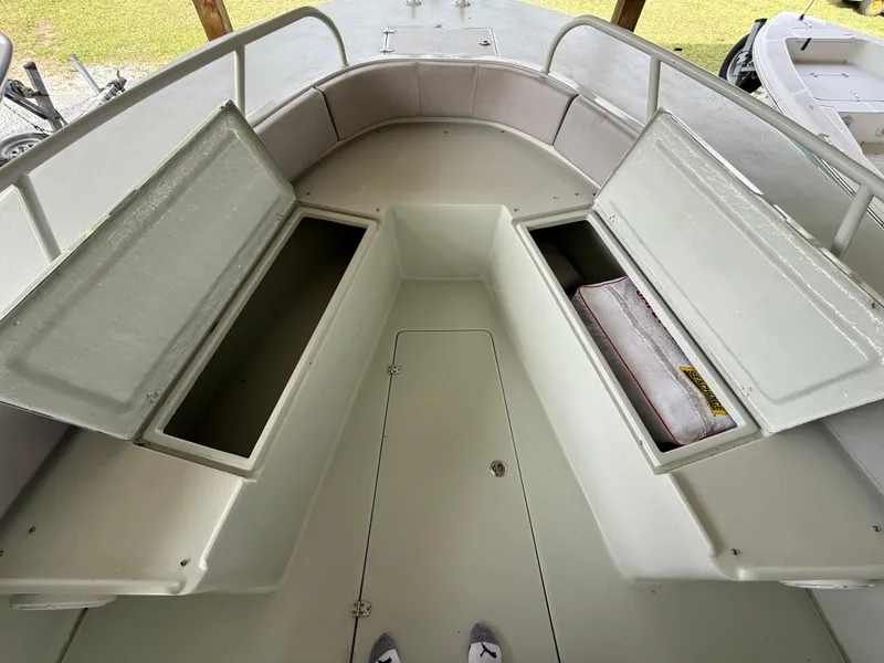Slide: The Image of 2004 Boston Whaler Guardian 27 boat interior with open storage compartments. - 11