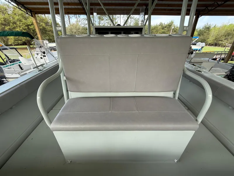 Slide: The Image of Boston Whaler Guardian 27 boat seat, 2004 model, under a covered dock. - 26