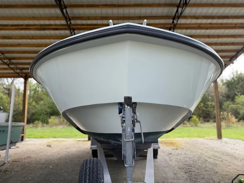 Slide: The Image of 2004 Boston Whaler Guardian 27 boat on trailer under shelter. - 6