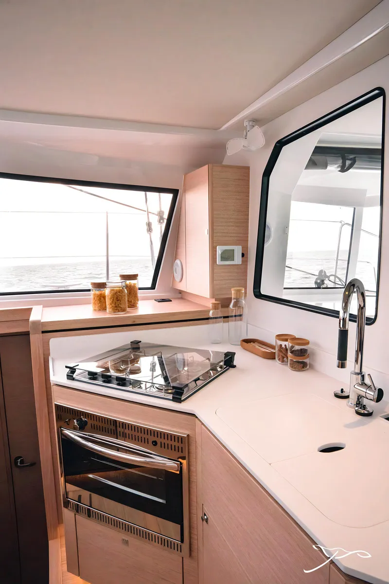 Slide: The Image of Modern kitchen interior of 2025 Nautitech 40 Open catamaran with sleek design and ocean view. - 40