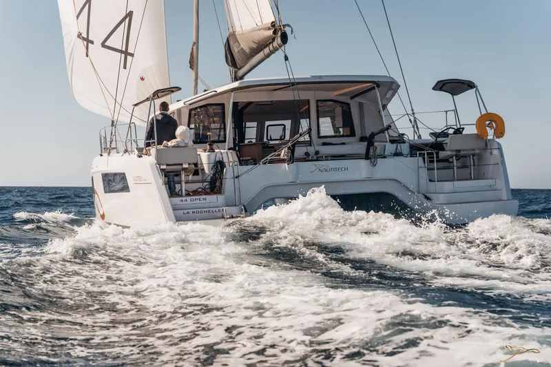 Slide: The Image of 2025 Nautitech 44 Open sailing on the ocean, showcasing sleek design and performance. - 0