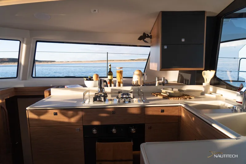 Slide: The Image of Modern kitchen interior of 2025 Nautitech 48 Open yacht with ocean view. - 49