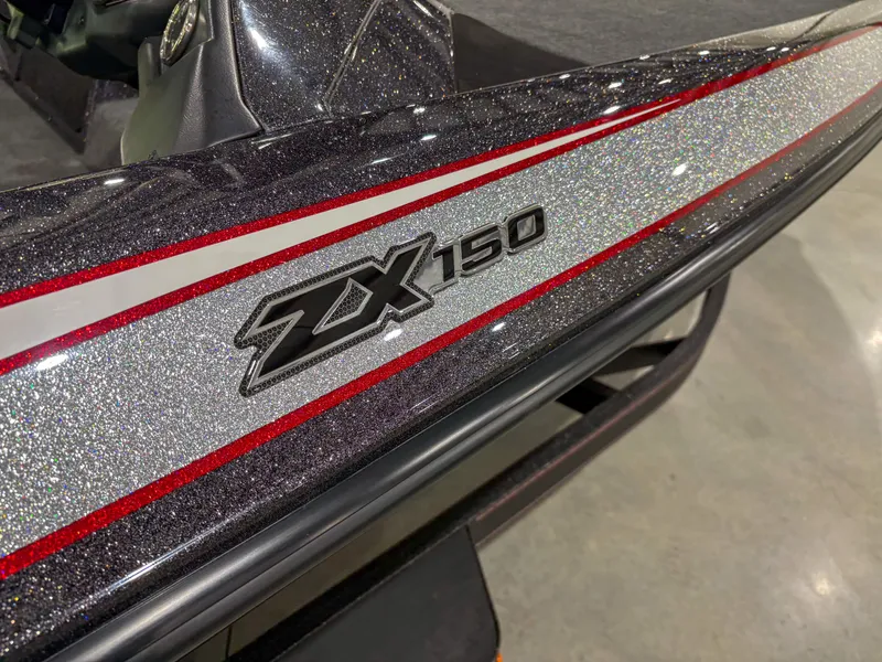 Slide: The Image of 2025 Skeeter ZX150 boat with glittery finish and red accents. - 12