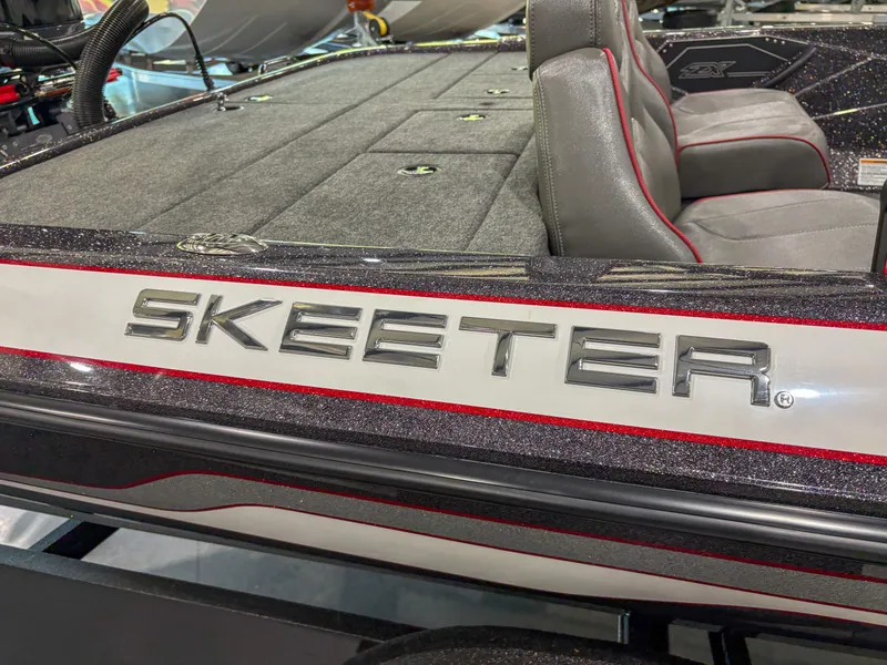 Slide: The Image of 2025 Skeeter ZX150 boat interior with sleek seating and storage compartments. - 13