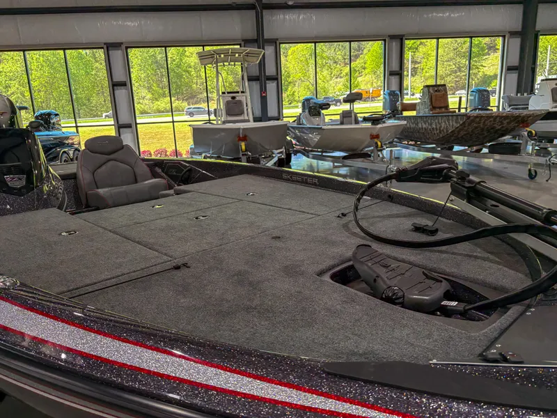 Slide: The Image of 2025 Skeeter ZX150 bass boat interior with spacious deck and modern controls. - 5