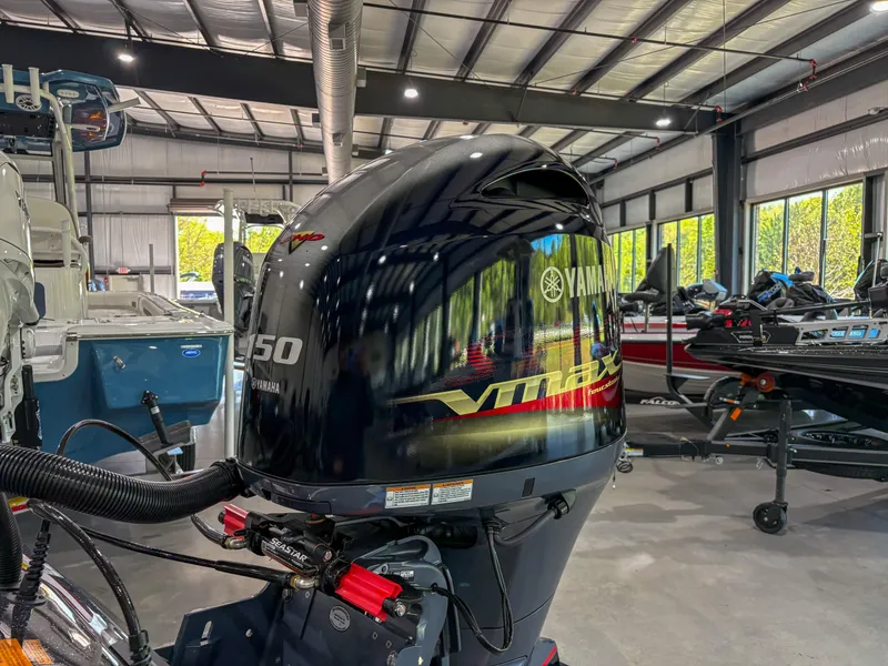 Slide: The Image of 2025 Skeeter ZX150 with Yamaha V150 engine in a showroom. - 9