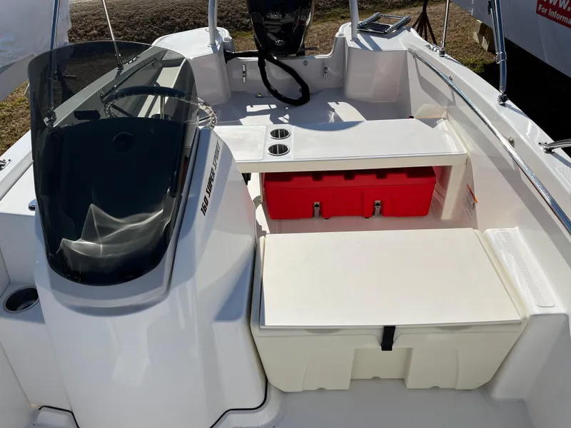 Slide: The Image of 2025 Boston Whaler 160 Super Sport interior with seating and storage compartments. - 11