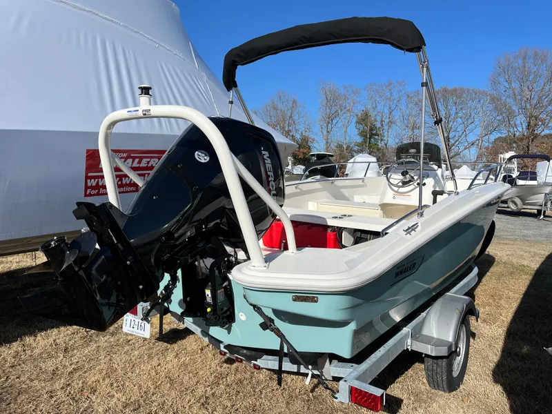 Slide: The Image of 2025 Boston Whaler 160 Super Sport boat on trailer, outdoor display. - 18