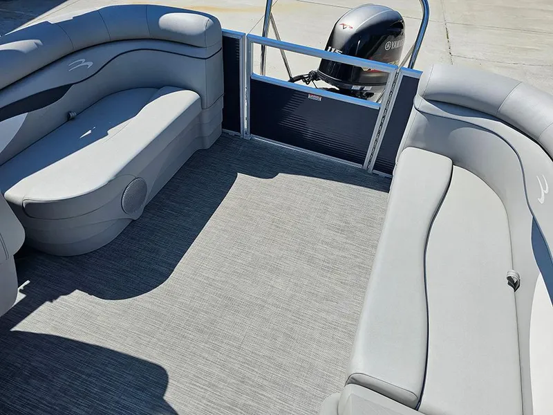 Slide: The Image of 2021 Bennington 20 SSR pontoon boat interior with gray seating and Yamaha outboard motor. - 11
