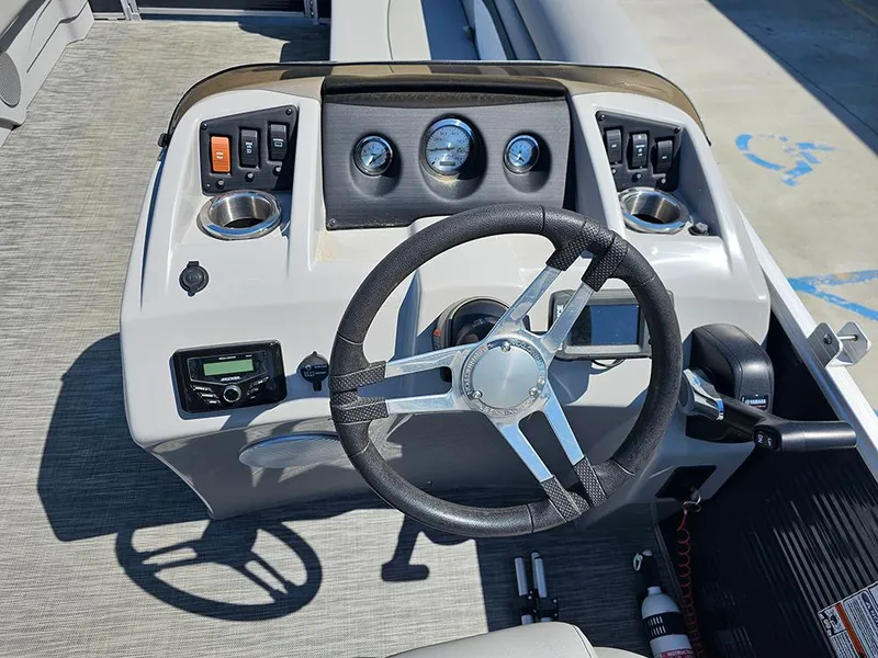 Slide: The Image of Steering console of a 2021 Bennington 20 SSR boat with gauges and controls. - 14