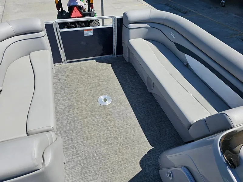 Slide: The Image of 2021 Bennington 20 SSR pontoon boat interior with spacious seating and carpeted floor. - 17