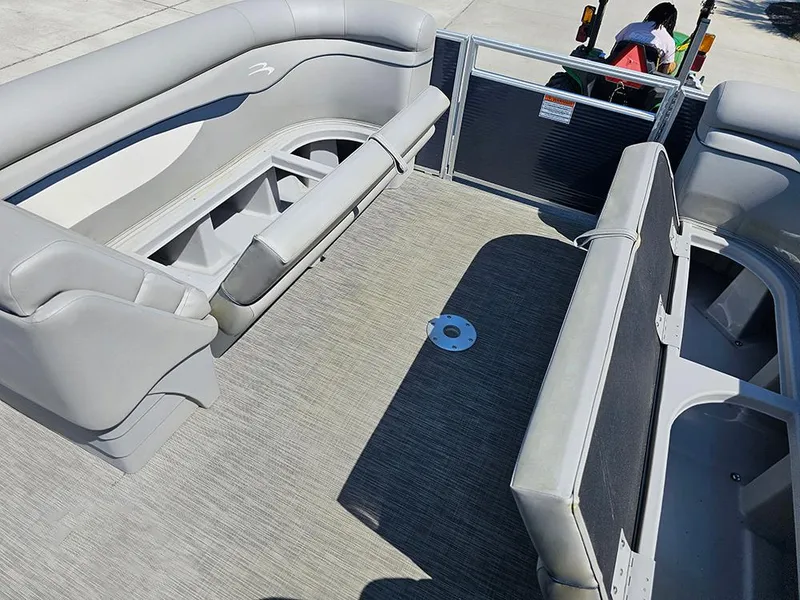 Slide: The Image of 2021 Bennington 20 SSR pontoon boat interior with gray seating and spacious layout. - 18