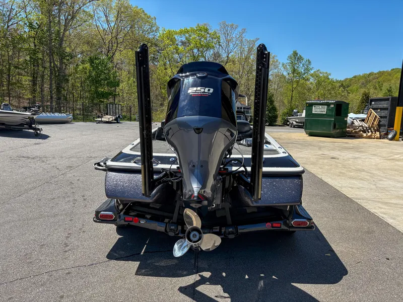 Slide: The Image of 2014 Skeeter FX 21 boat with 250 HP engine, parked outdoors. - 4