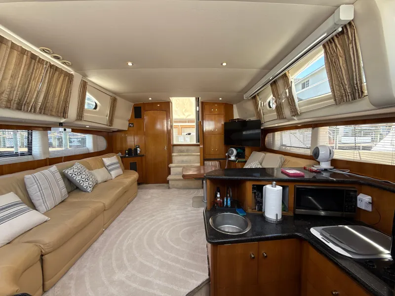 Slide: The Image of Luxurious interior of 2001 Carver 396 Motor Yacht with spacious seating and modern amenities. - 17