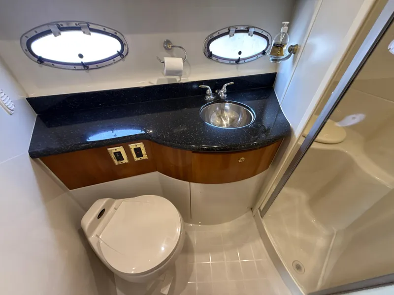 Slide: The Image of Bathroom interior of 2001 Carver 396 Motor Yacht with sink, toilet, and shower. - 24