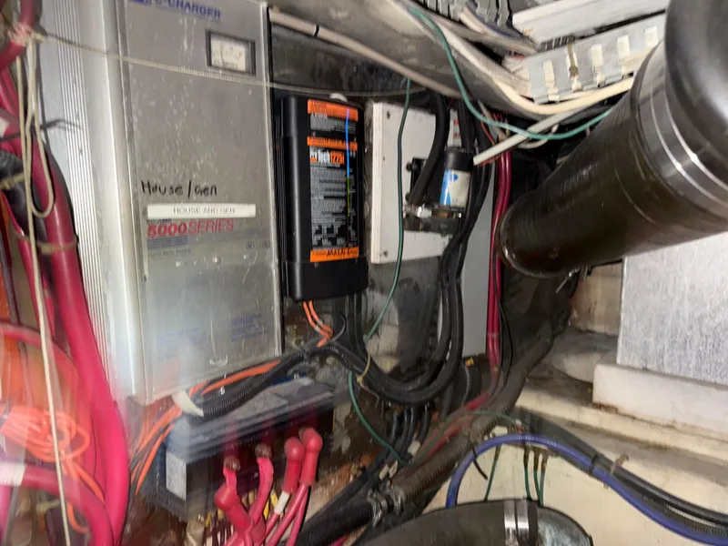 Slide: The Image of Engine room of 2001 Carver 396 Motor Yacht with electrical components and wiring. - 26
