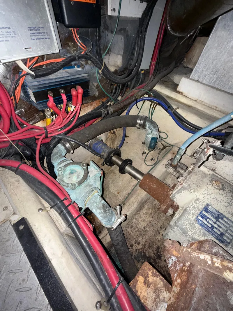 Slide: The Image of Engine room of 2001 Carver 396 Motor Yacht with visible wiring and mechanical components. - 30