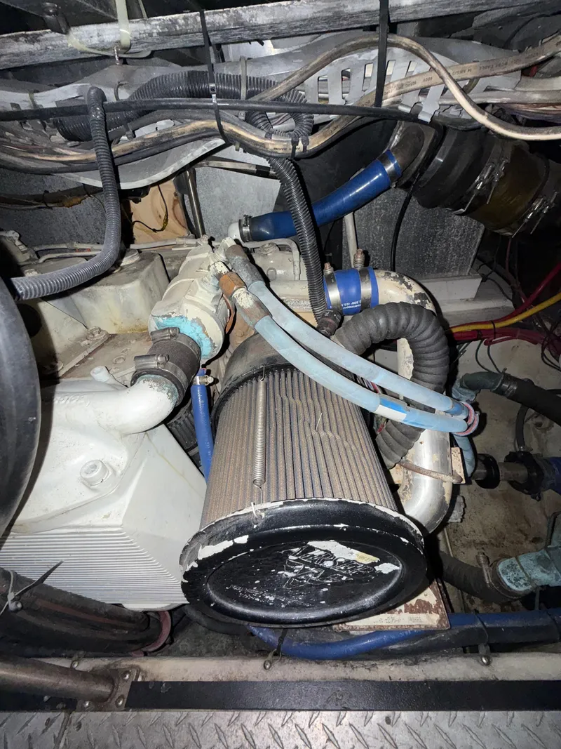 Slide: The Image of Engine compartment of a 2001 Carver 396 Motor Yacht, showing hoses and components. - 31