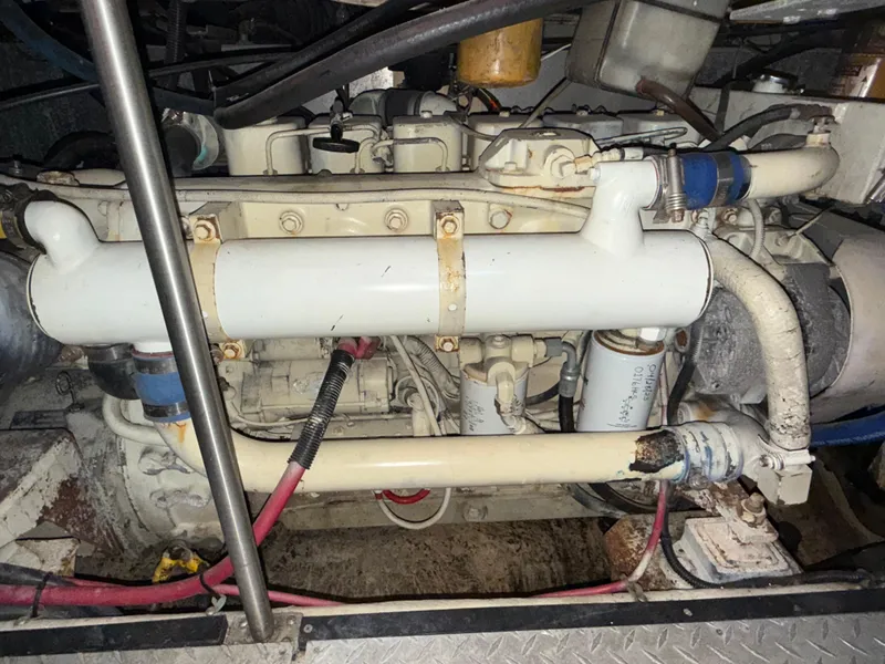 Slide: The Image of Engine compartment of a 2001 Carver 396 Motor Yacht, showing mechanical components and wiring. - 32