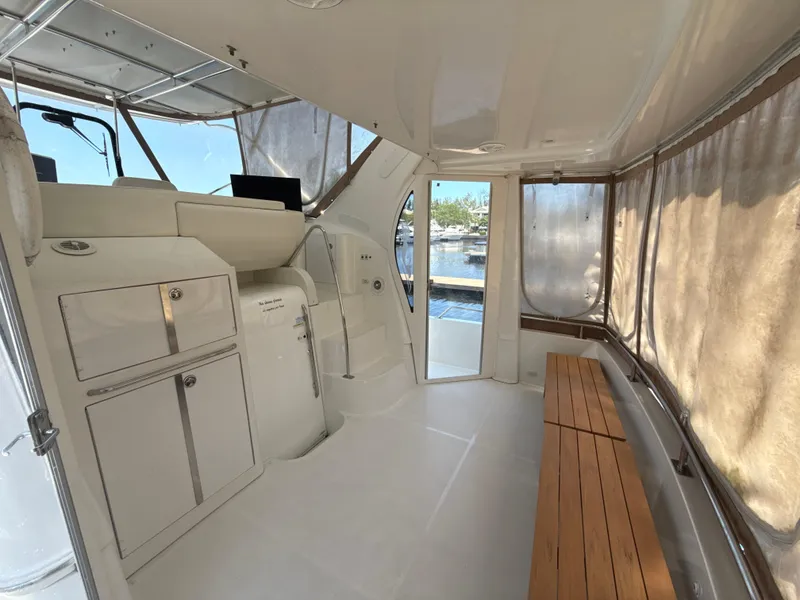Slide: The Image of Interior of 2001 Carver 396 Motor Yacht with seating and helm station. - 4