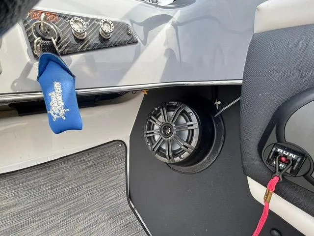 Slide: The Image of 2021 Glastron GTS 185 boat interior with speaker and control panel. - 20