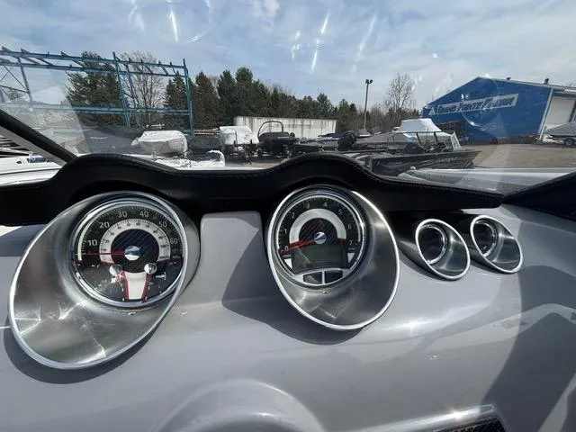 Slide: The Image of Dashboard of 2021 Glastron GTS 185 boat with gauges and controls. - 21