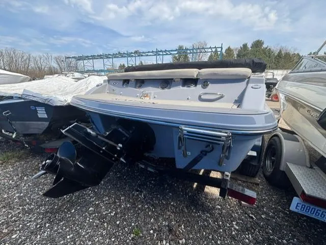 Slide: The Image of 2021 Glastron GTS 185 boat on trailer, rear view, outdoors. - 36