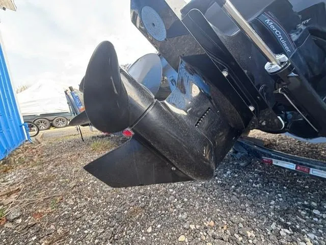 Slide: The Image of 2021 Glastron GTS 185 boat propeller and outdrive on gravel surface. - 40