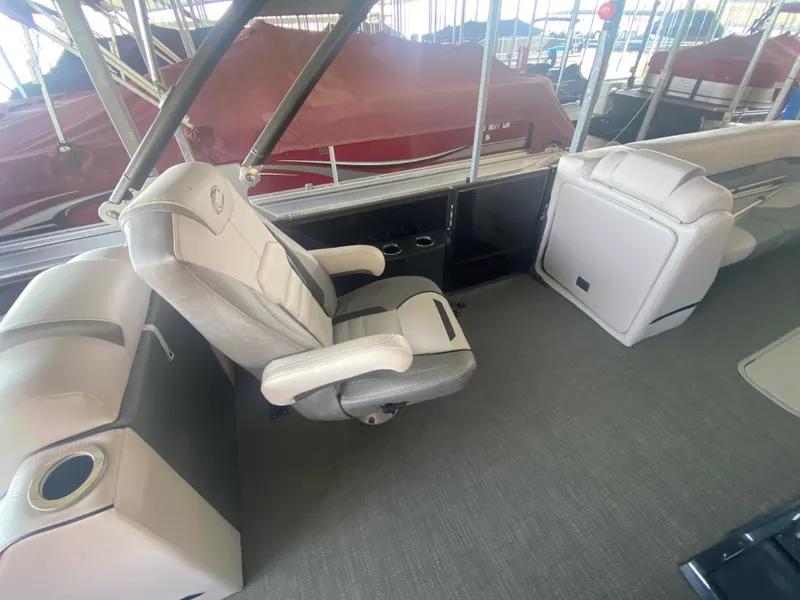 Slide: The Image of 2018 Crest Caliber 250 SLRC boat interior with plush seating and modern design. - 10