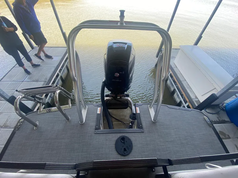 Slide: The Image of 2018 Crest Caliber 250 SLRC boat with outboard motor at dockside. - 12
